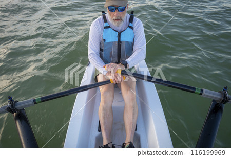 senior man in a rowing shell on a lake in Colorado senior man in a rowing shell on a lake in Colorado 116199969