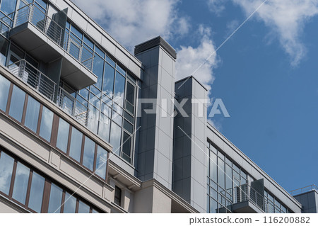 Facade of a modern residential building, building texture 116200882