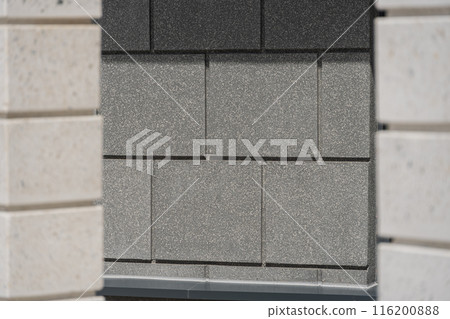 Facade of a modern residential building, building texture 116200888