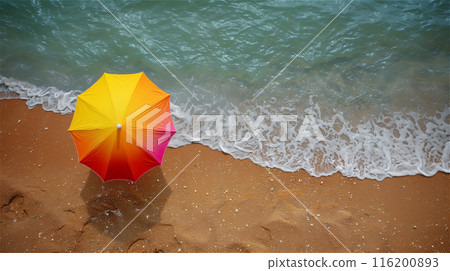 Yellow and red umbrella on the beach between sand and water. Copy space 116200893