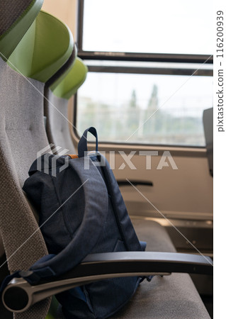 The backpack is on the seat, travel concept. The backpack is on the seat, travel concept. 116200939