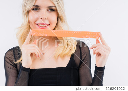 Young woman, female patient isolated on white studio background. Correction of asymmetry concept. Young woman, female patient isolated on white studio background. Correction of asymmetry concept. 116201022