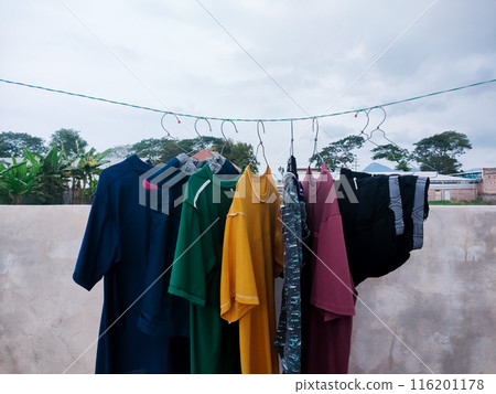 clothes hanging on the clothesline 116201178