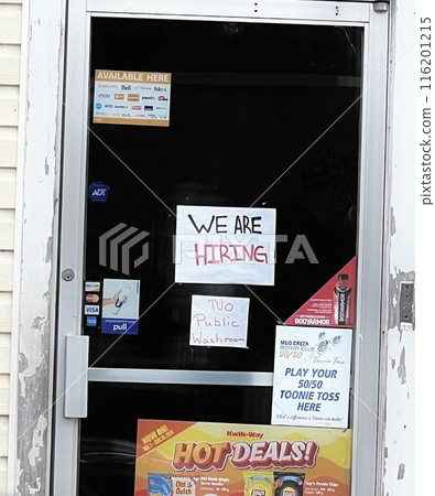 A staff recruitment notice on the door of a convenience store 116201215