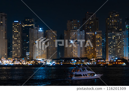 View of modern skyscrapers in Jumeirah beach residence on November in Dubai, JBR - artificial canal city, carved along a 3 km stretch of Persian Gulf shoreline. High quality photo View of modern skyscrapers in Jumeirah beach residence on November in Dubai, JBR - artificial canal city, carved along a 3 km stretch of Persian Gulf shoreline. High quality photo 116201309