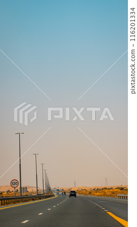 Fujairah mountains, extension of Omani Al Hajar mountain range. Cloudy winter day on empty street. High quality photo Fujairah mountains, extension of Omani Al Hajar mountain range. Cloudy winter day on empty street. High quality photo 116201334