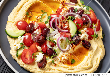 Greek hummus with veggies, olives, feta on plate 116201553