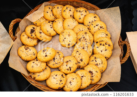 Homemade cookies with chocolate chunks on a tray. Perfect for snacks or dessert, these delicious treats Homemade cookies with chocolate chunks on a tray. Perfect for snacks or dessert, these delicious treats 116201633