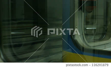 Subway car in the underground tunnels. Underground transport. Electric train in a tunnel. Public transport. 116201879