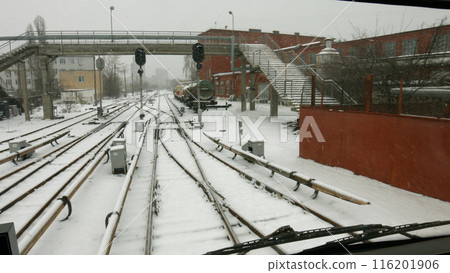 Railway industrial zone. An old factory with an overpass. Winter in an industrial city. Railway industrial zone. An old factory with an overpass. Winter in an industrial city. 116201906