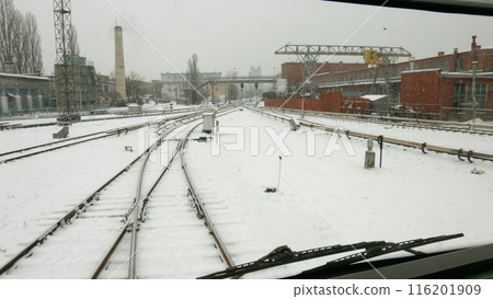 The train moves along the infrastructure of the depot. Industrial part of the city. The train moves along the infrastructure of the depot. Industrial part of the city. 116201909