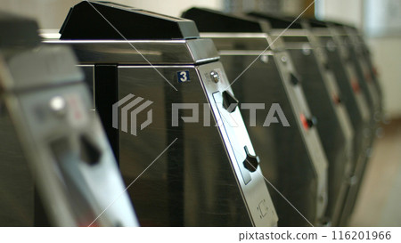 Turnstiles at the entrance to the subway. Public transport metro station. Turnstiles at the entrance to the subway. Public transport metro station. 116201966