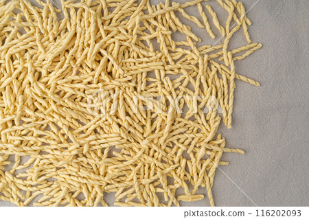 Raw Trofie Pasta, Dry Italian Macaroni, Traditional Genoa Food, Raw Noodle, Modern Ligurian Cuisine Raw Trofie Pasta, Dry Italian Macaroni, Traditional Genoa Food, Raw Noodle, Modern Ligurian Cuisine 116202093