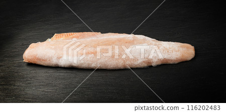 Frozen Fish on Black Plate, Red Trout Fillet, Iced Salmon Filet, Frozen Iced Red Fish Meat and Skin Frozen Fish on Black Plate, Red Trout Fillet, Iced Salmon Filet, Frozen Iced Red Fish Meat and Skin 116202483