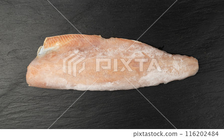 Frozen Fish on Black Plate, Red Trout Fillet, Iced Salmon Filet, Frozen Iced Red Fish Meat and Skin Frozen Fish on Black Plate, Red Trout Fillet, Iced Salmon Filet, Frozen Iced Red Fish Meat and Skin 116202484