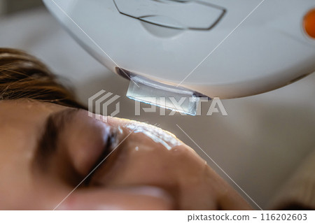 Phototherapy, photorejuvenation, IPL in a beauty salon. Care for a woman's face. Phototherapy, photorejuvenation, IPL in a beauty salon. Care for a woman's face. 116202603