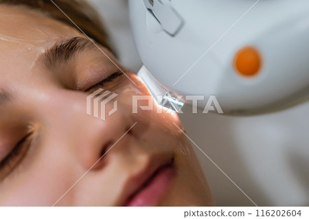 Phototherapy, photorejuvenation, IPL in a beauty salon. Care for a woman's face. Phototherapy, photorejuvenation, IPL in a beauty salon. Care for a woman's face. 116202604
