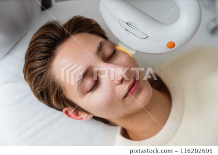 Phototherapy, photorejuvenation, IPL in a beauty salon. Care for a woman's face. Phototherapy, photorejuvenation, IPL in a beauty salon. Care for a woman's face. 116202605