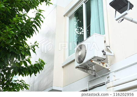 Air conditioner compressor installed outside the house Air conditioner compressor installed outside the house 116202956