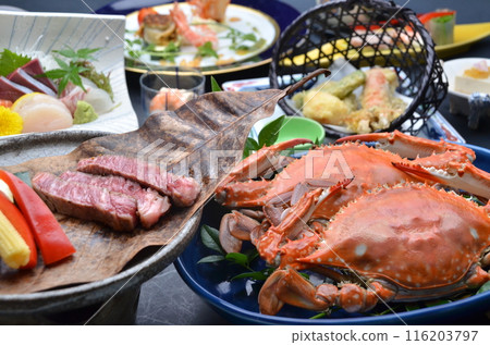 A colorful dinner course featuring a fusion of fresh crab and beef 116203797