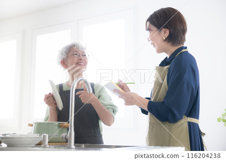 Teacher and students learning at a cooking class Teacher and students learning at a cooking class 116204238
