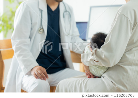 Doctor examining a baby 116205703