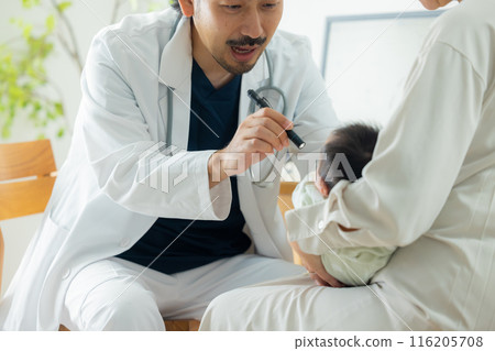 Doctor examining a baby 116205708