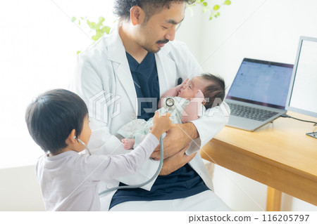 Male doctor examining a boy Male doctor examining a boy 116205797