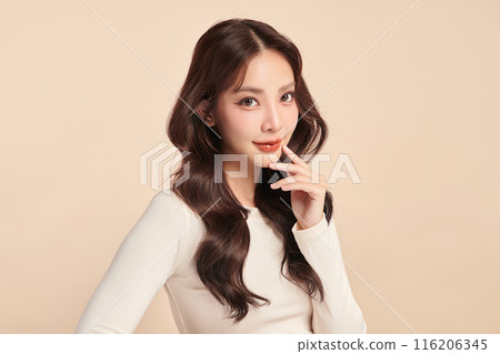 Beautiful young asian woman with clean fresh skin on beige background, Face care, Facial treatment, Cosmetology, beauty and spa, Asian women portrait. Beautiful young asian woman with clean fresh skin on beige background, Face care, Facial treatment, Cosmetology, beauty and spa, Asian women portrait. 116206345