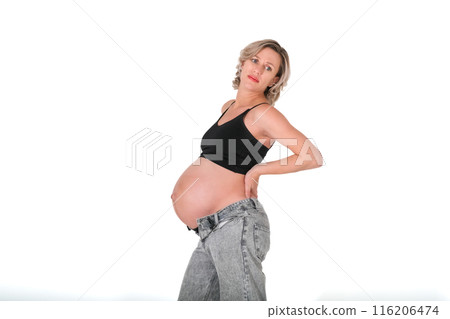 pregnant woman with backache - holding back pregnant woman with backache - holding back 116206474