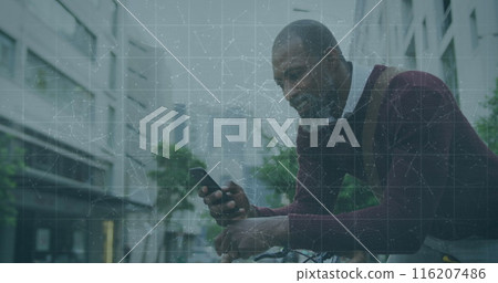 African American senior business mentor, wearing sweater, checking smartphone 116207486