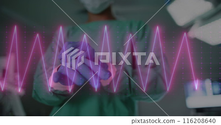 Image of heart rate monitor against mid section of male surgeon wearing surgical gloves 116208640