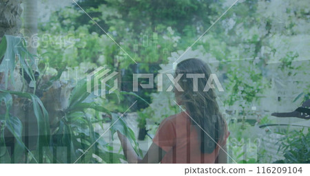 Image of multiple graphs over rear view of biracial woman walking and touching plants Image of multiple graphs over rear view of biracial woman walking and touching plants 116209104