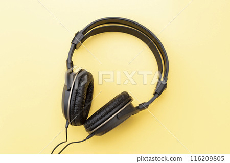 Headphones on a yellow background Headphones on a yellow background 116209805