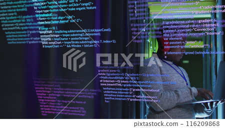 An African American man in his early thirties is working on laptop, surrounded by code on a screen An African American man in his early thirties is working on laptop, surrounded by code on a screen 116209868