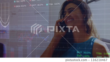 Image of multiple graphs, trading board over smiling biracial woman talking on smartphone Image of multiple graphs, trading board over smiling biracial woman talking on smartphone 116210467