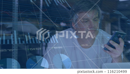 Image of graphs, changing numbers, caucasian man talking on cellphone while working on laptop Image of graphs, changing numbers, caucasian man talking on cellphone while working on laptop 116210499