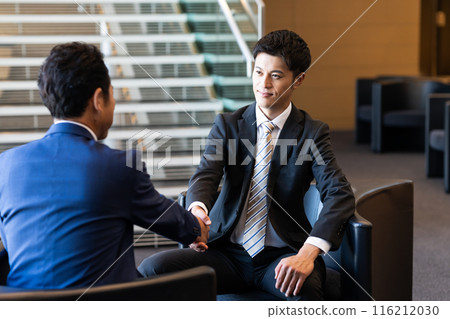 Businessmen discussing Businessmen discussing 116212030