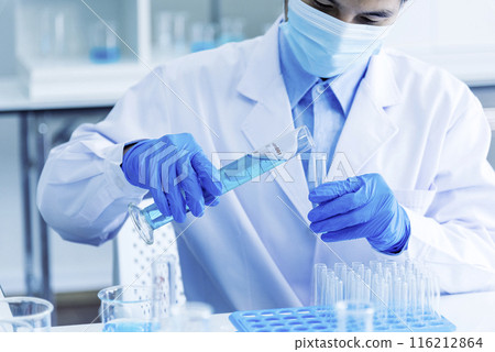 Scientist man holding sample blood test tube in science laboratory. Doctor clinic healthcare technician lab testing blood sample diagnosis. Asian man scientist working in hiv testing medical lab. 116212864