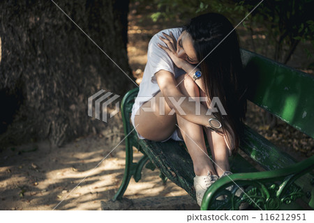 Recession Stress Woman using laptop work hard at home office outdoor in green park. Young women have headache, depressed from failure business burnout. Tired Asian woman despair sadness problems Recession Stress Woman using laptop work hard at home office outdoor in green park. Young women have headache, depressed from failure business burnout. Tired Asian woman despair sadness problems 116212951
