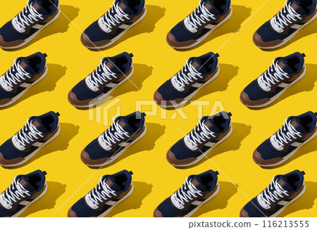Sneakers shoes pattern on yellow background. 116213555