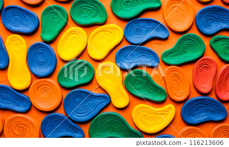Colorful abstract shapes pattern on orange background, vibrant blue yellow red flat stones design, artistic arrangement for creative backdrop or wallpaper Colorful abstract shapes pattern on orange background, vibrant blue yellow red flat stones design, artistic arrangement for creative backdrop or wallpaper 116213606