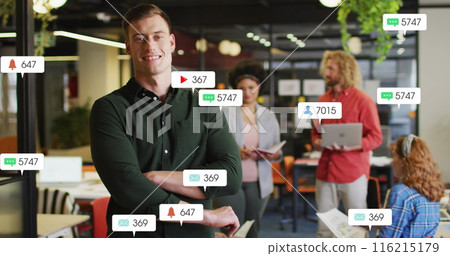 Image of social media data processing over diverse business people in office 116215179