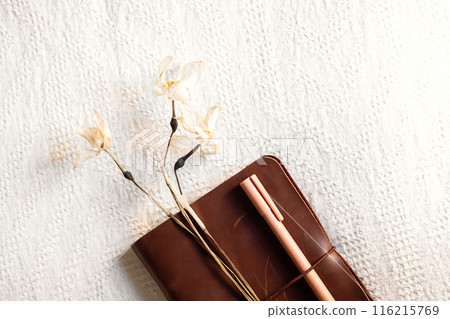 Notebook and drying flowers, autumn still life. 116215769