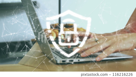 Image of security padlock icon against mid section of a woman using a laptop at office 116216226