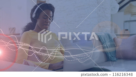 Image of music data processing over african american woman with headphones Image of music data processing over african american woman with headphones 116216348