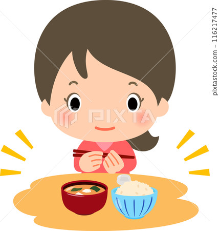 A woman eating brown rice and miso soup 116217477