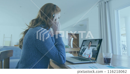 Image of young caucasian woman video conferencing with caucasian man on a laptop 116218062
