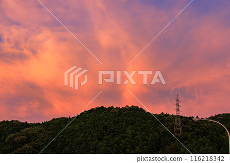 Summer 2024 Nunome Dam evening view: opposite side of the dam, crimson clouds in the sky, burning sunset sky① 116218342