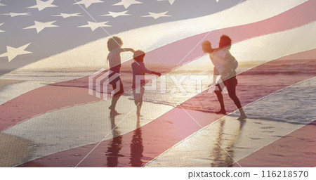 Image of flag of united states of america over african american family on beach Image of flag of united states of america over african american family on beach 116218570